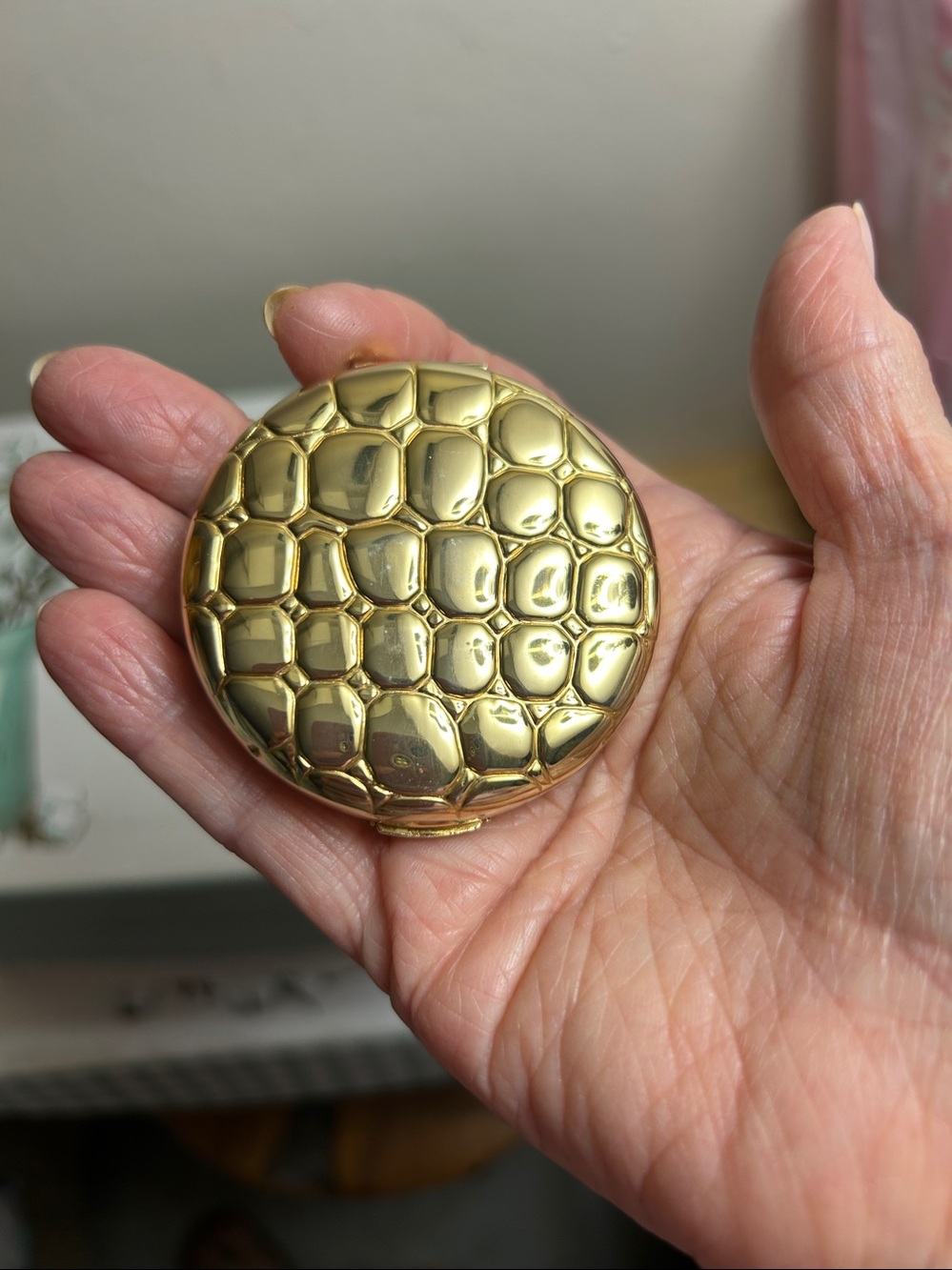 Vintage Estée Lauder gold compact.